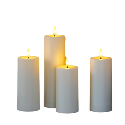 Set of four white candles with flame on a white background