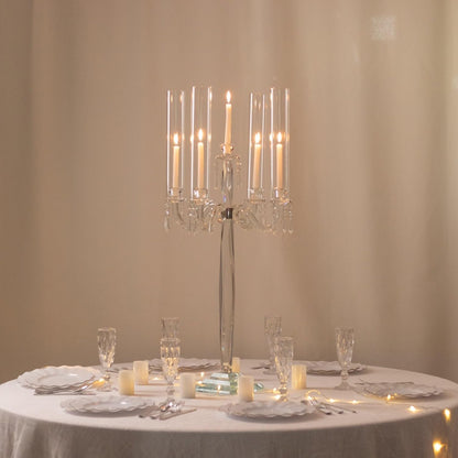 Elegant table setting with a crystal candle holder and candles on a beige background