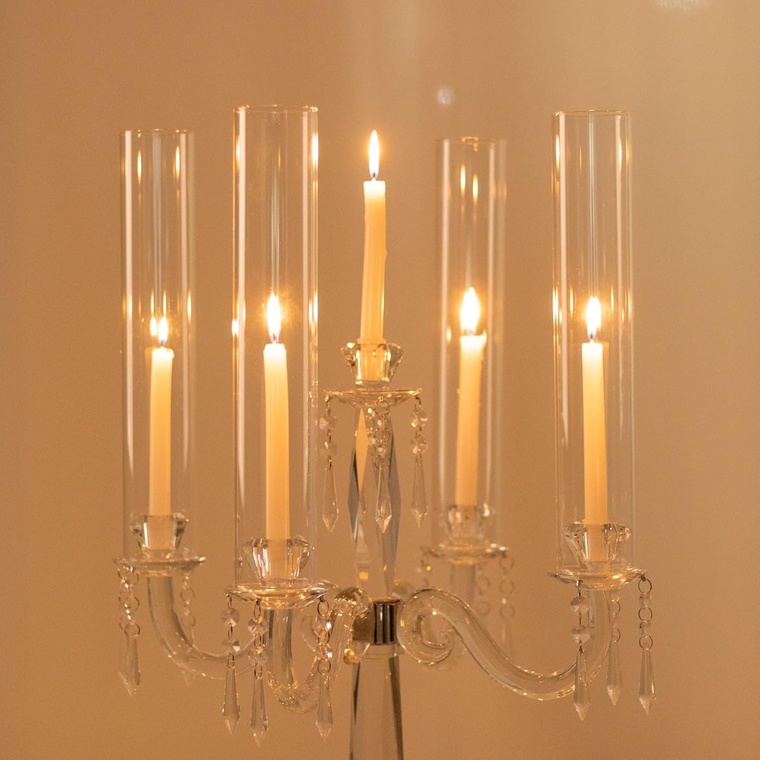 Candelabrum with multiple candles against a warm beige background