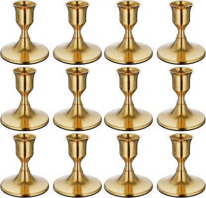 Set of 12 gold candle holders on a white background
