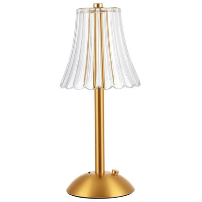 Gold table lamp with a clear pleated shade on a white background